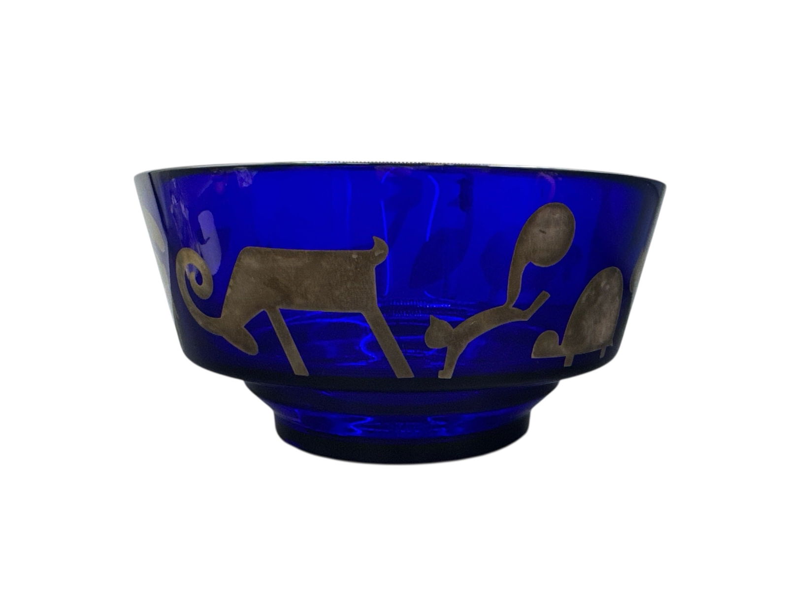 Rosenthal Egizia Blue Glass Bowl with Gilt Animal Motifs: This decorative blue glass bowl is by Rosenthal Egizia and features stylized gilt animal motifs encircling the exterior. The deep cobalt blue glass body is accented with gold silhouettes depicting