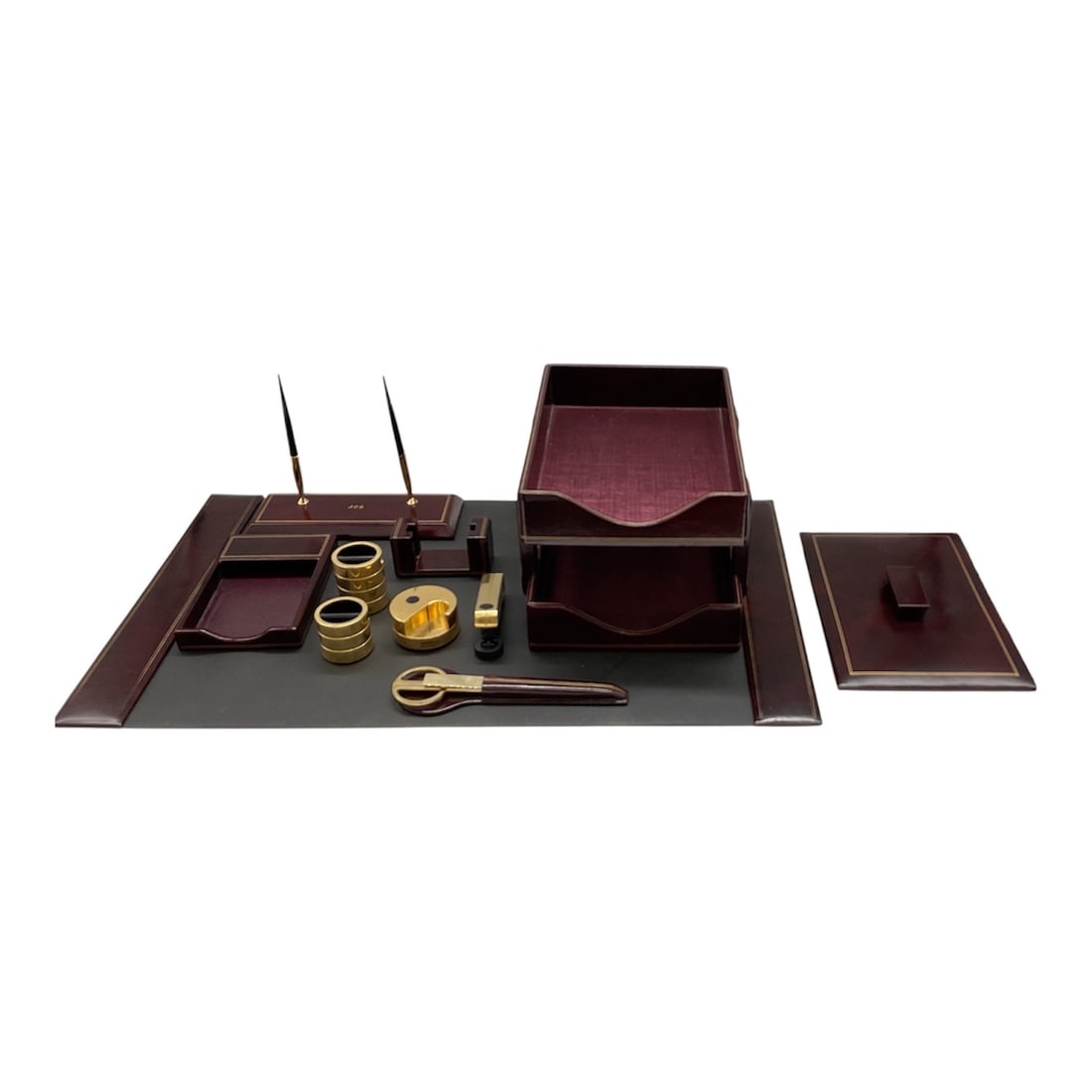 Executive Burgundy Leather Desk Organizer Set: Large Desk Pad: Provides a smooth, protective writing surface.Double Document Tray: Tiered for efficient paper management.Pen Stand with Base: Includes two gold-toned pen