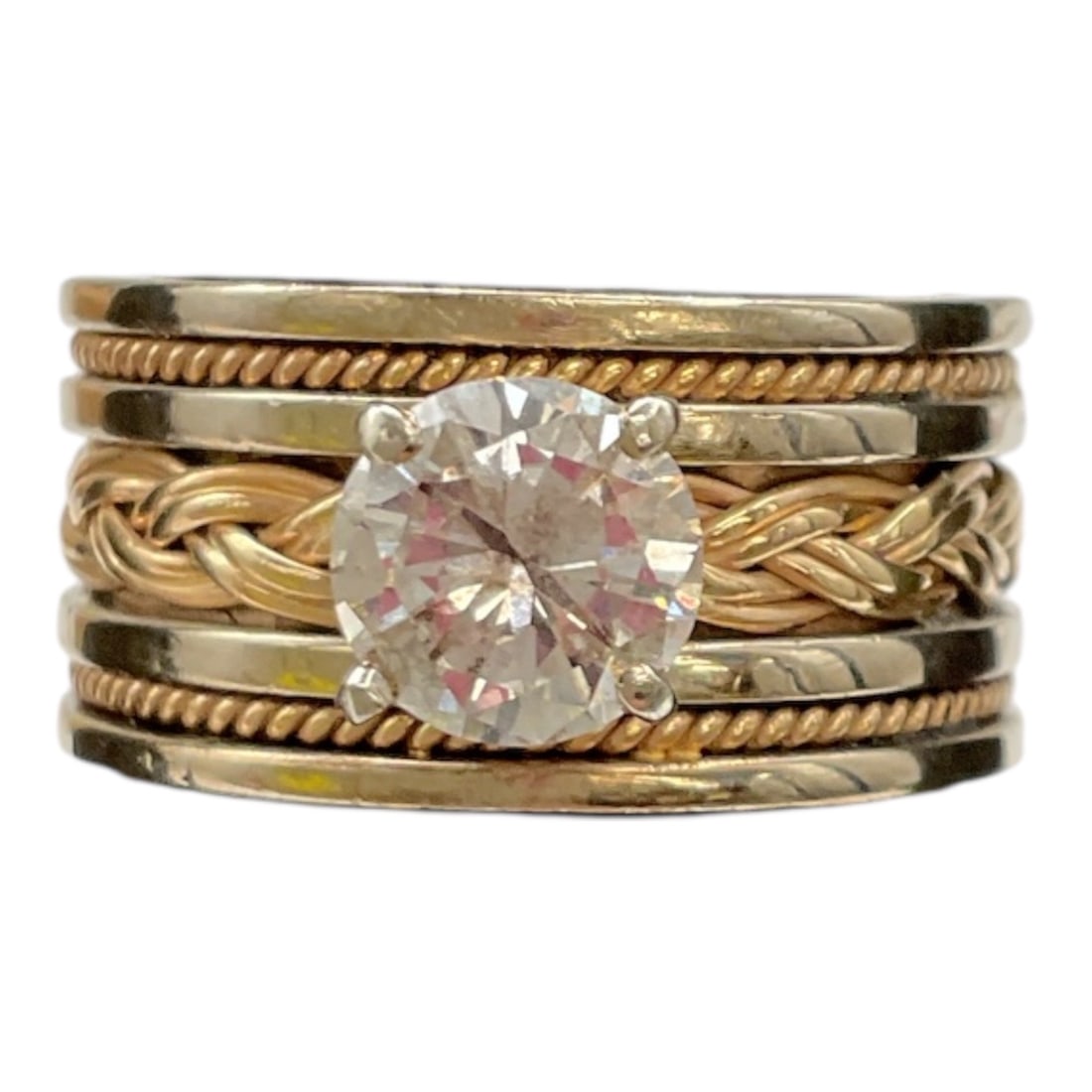 14 Karat Gold Diamond Ring Inscribed Forever Dean 93-06-19: This 14 karat gold ring features a prominent round brilliant cut diamond set in a multi-band design combining polished, rope-twist, and braided elements. The layered construction creates visual depth