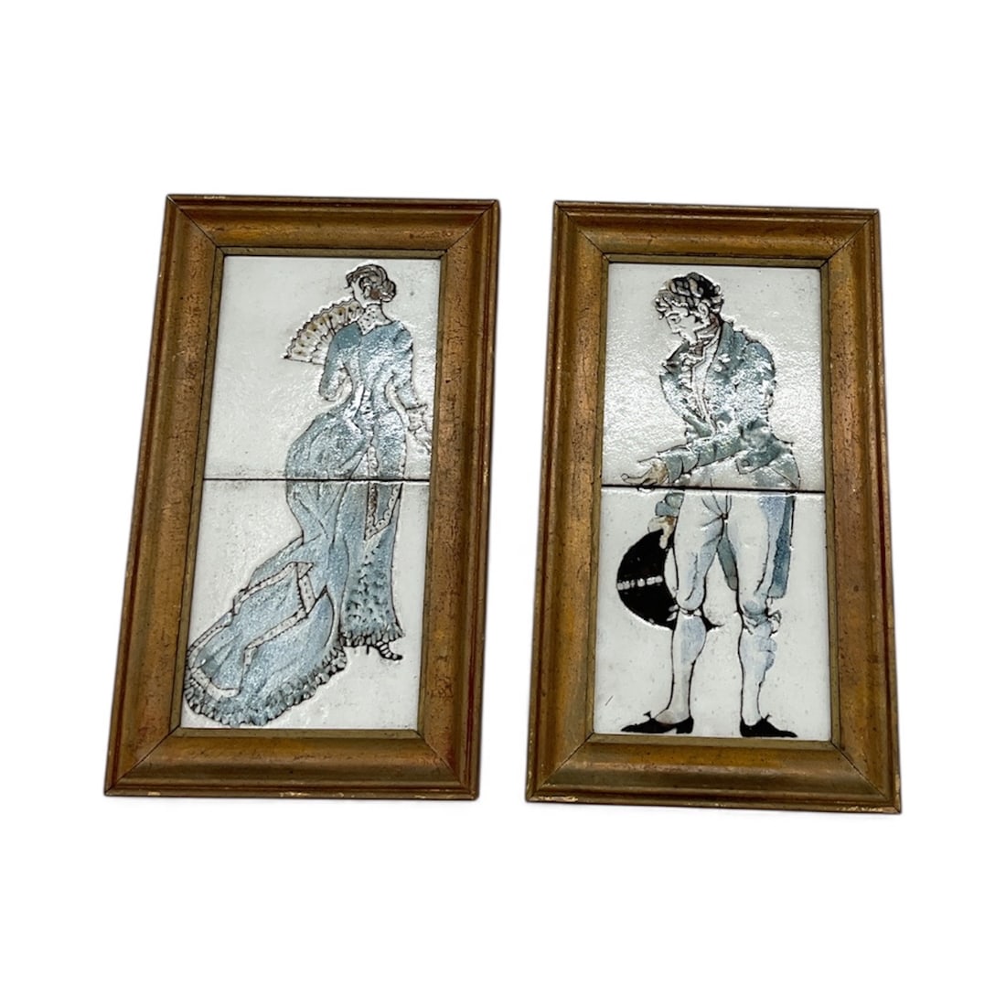 Victorian Couple Tile Panels: A decorative framed pair of ceramic tiles depicting an elegantly dressed Victorian lady and gentleman. Each tile features detailed etched linework and classic period styling, creating a refined and
