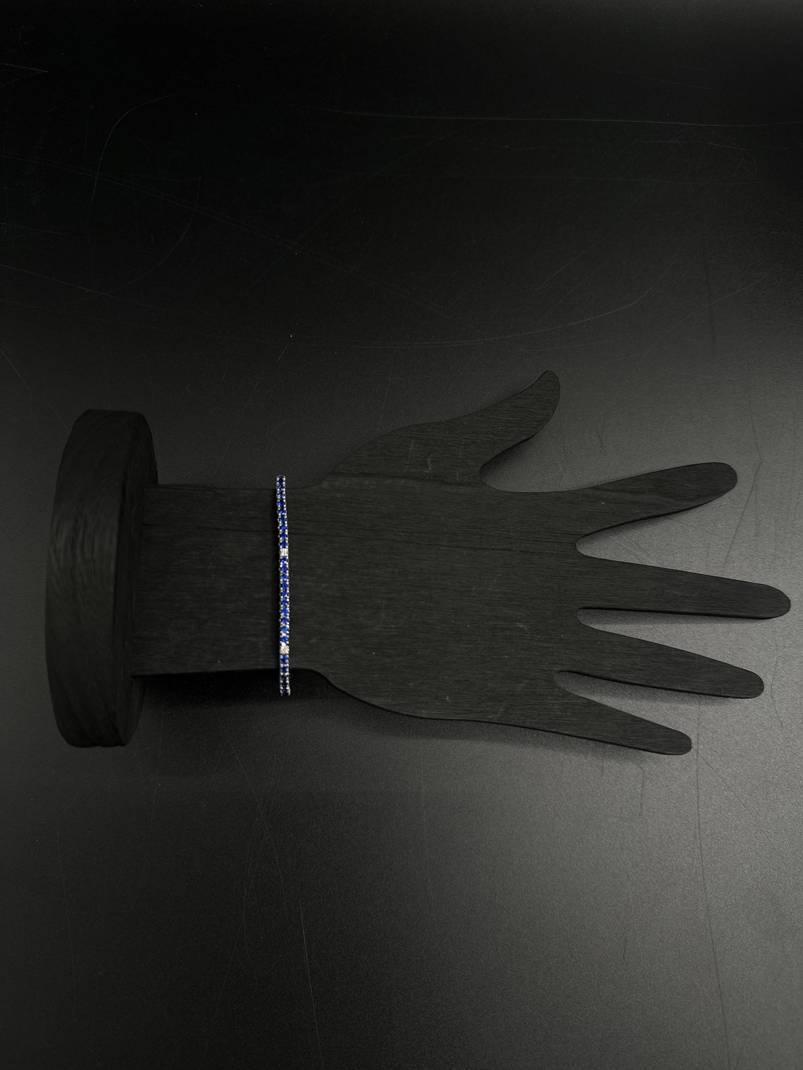 18kt Sapphire and Diamond Tennis Bracelet: Exquisite 18kt white gold tennis bracelet featuring alternating deep blue sapphire and diamond stones in prong settings. Sophisticated design, excellent condition. A timeless piece for luxury collecto