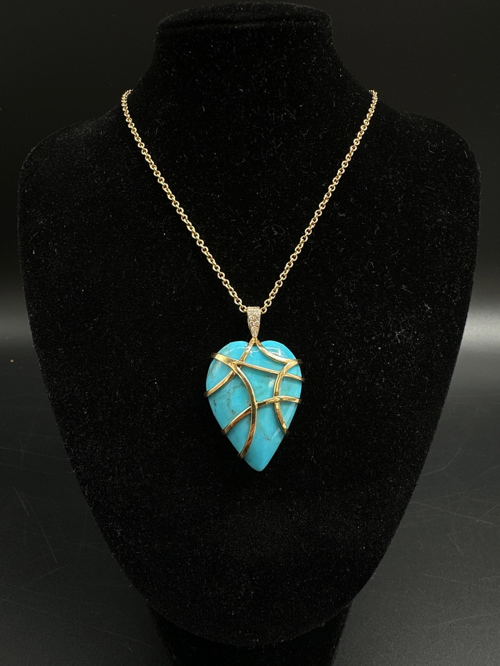 18kt Gold Turquoise and Diamond Necklace: Elegant 18kt yellow gold chain necklace featuring a natural heart-shaped turquoise pendant with diamond accents on the bail. Unique design, excellent condition. Perfect for luxury enthusiasts.Chain is