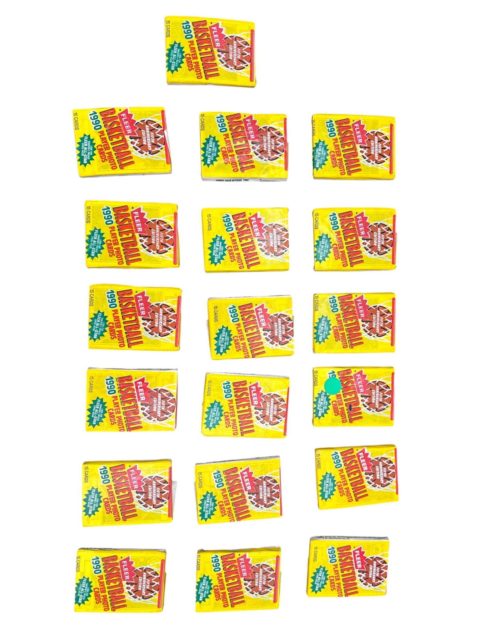 Collection of 19 Unopened 1990 Fleer Basketball Card Packs (15 Cards Each): Group of 19 unopened 1990 Fleer basketball card packs, each containing 15 cards. Classic early 1990s NBA release featuring players from the era. Packs remain factory sealed.Condition Report:Packs are