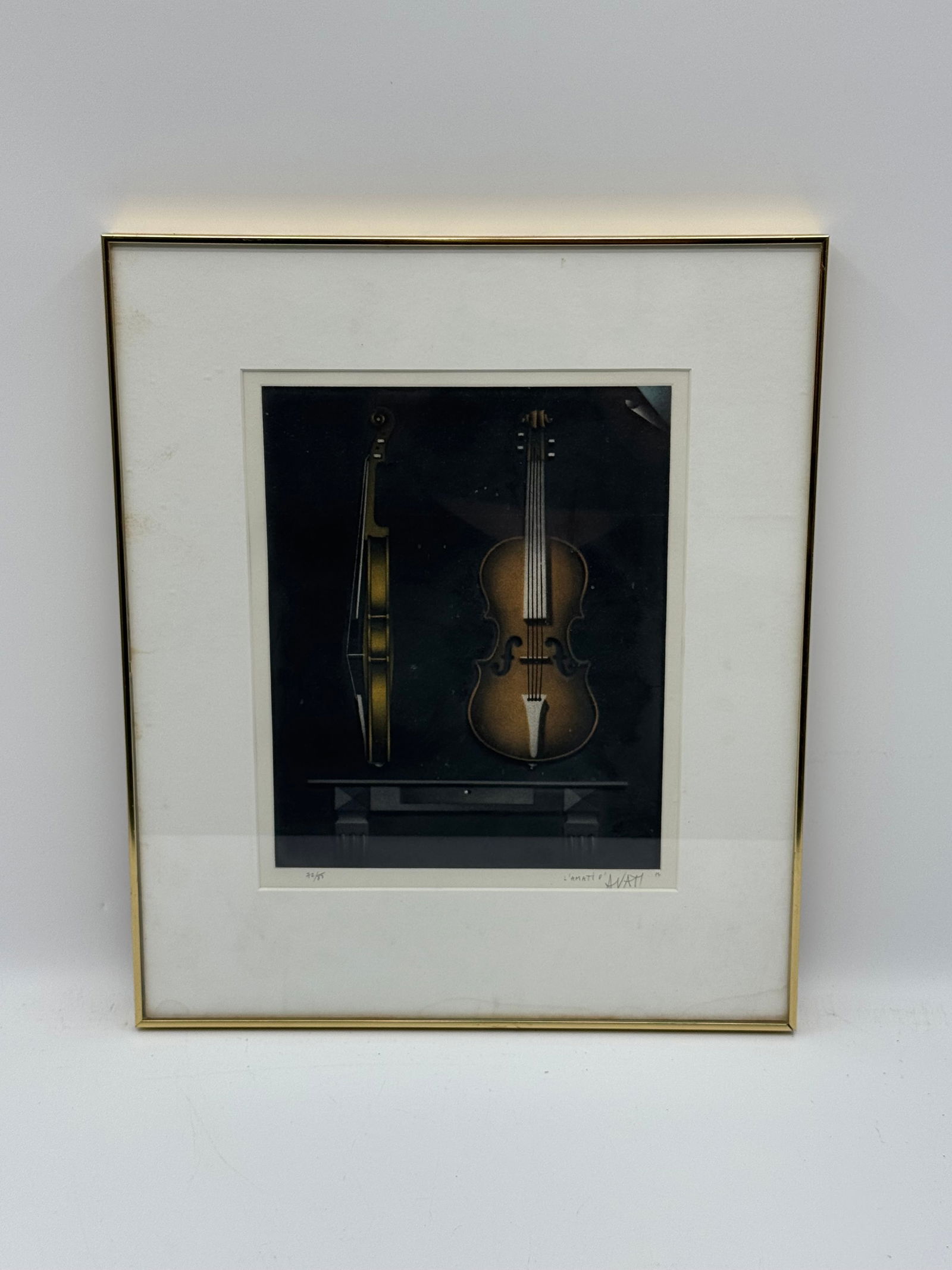 Mario Avati (French, 1921-2009) Mezzotint: Description: Framed print featuring violins, titled 'L'Amati' numbered 72/85. Signed in pencil bottom right. Medium: mezzotintDimensions: H:20in W:17in