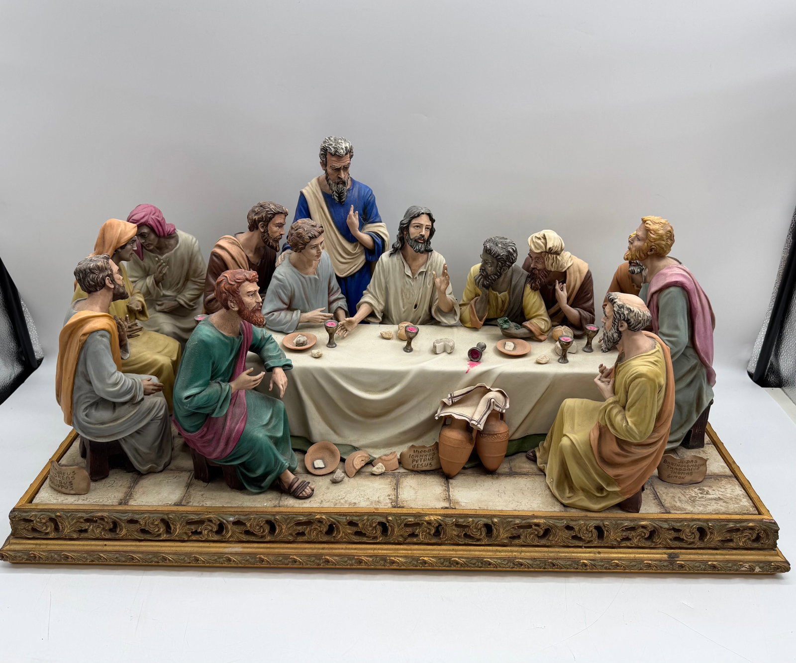 Capodimonte Last Supper Porcelain Scene: Figural sculpture depicting The Last Supper. Features hand-painted details and a decorative base. Dimensions: 34 x 17 x 15 inches.