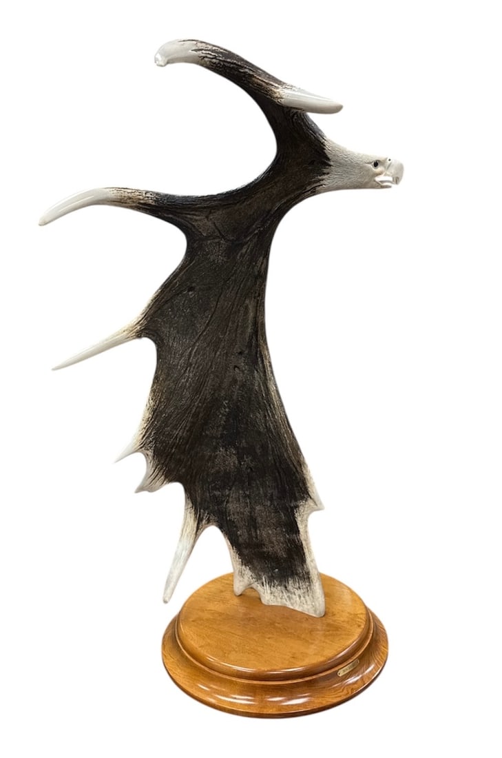 Don Stone Mounted Antler Sculpture Eagle Face Form on Wooden Base: Impressive large mounted antler sculpture signed Don Stone, creatively shaped to resemble an eagle’s face in profile. The dramatic natural antler form is mounted upright on a polished wooden bas