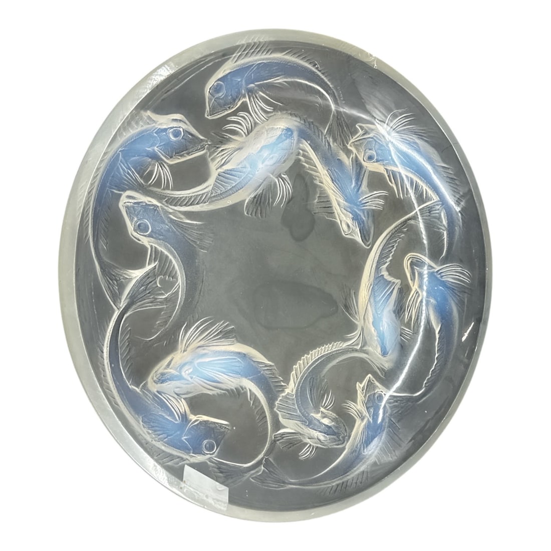 Lalique France Art Glass Bowl with Swimming Fish Motif: This elegant Lalique France art glass bowl features a circular design adorned with molded swimming fish in soft frosted and blue-toned relief. The fish form a continuous ring around the interior, crea