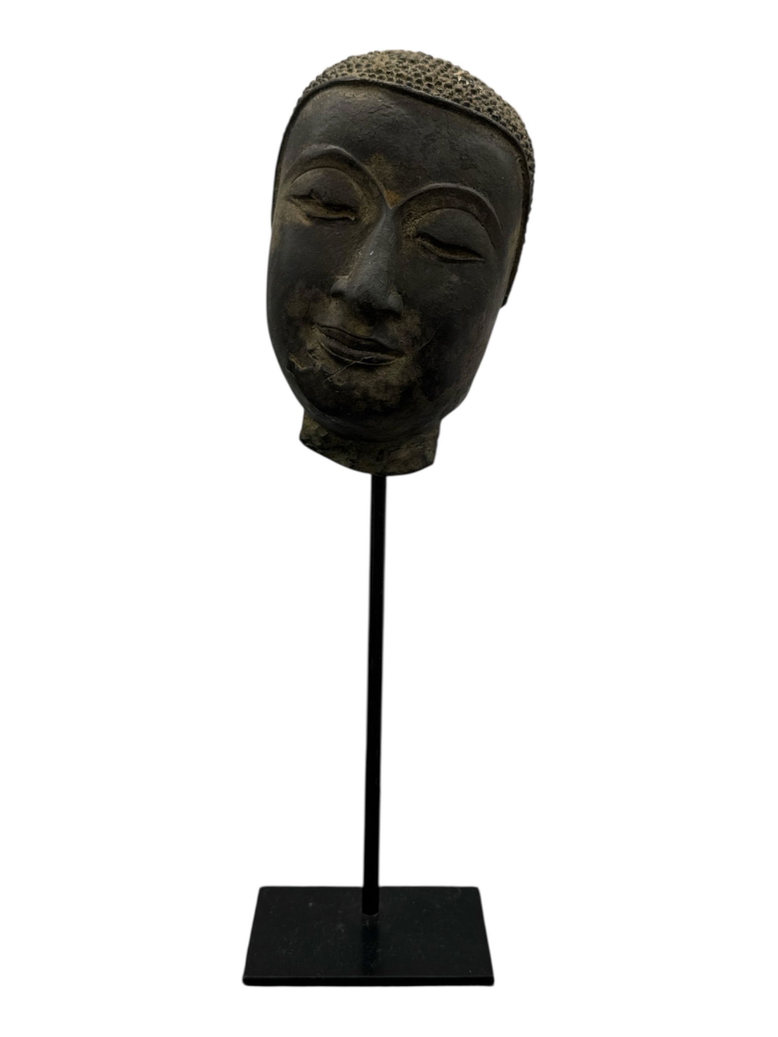 18th–19th Century Southeast Asian Bronze Buddha Head on Stand: DescriptionCast bronze head of Buddha dating to the 18th–19th century, featuring a serene expression with gently arched brows,