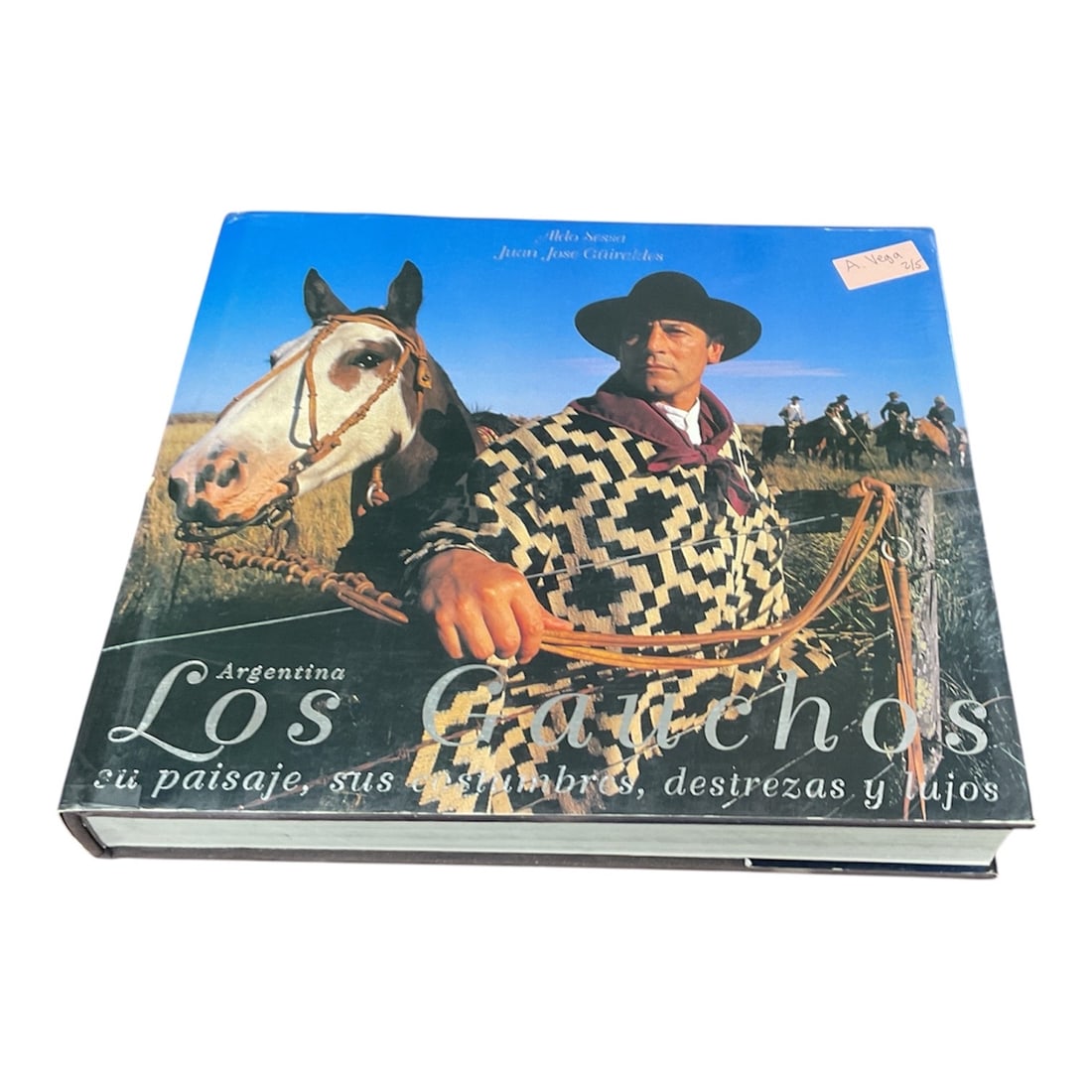 Argentina Los Gauchos Book on Landscape Culture Skills and Traditions: This illustrated hardcover book titled Argentina Los Gauchos explores the rich heritage, traditions, and rural life of the Argentine gaucho. Through vivid photography and engaging text, the volume cap