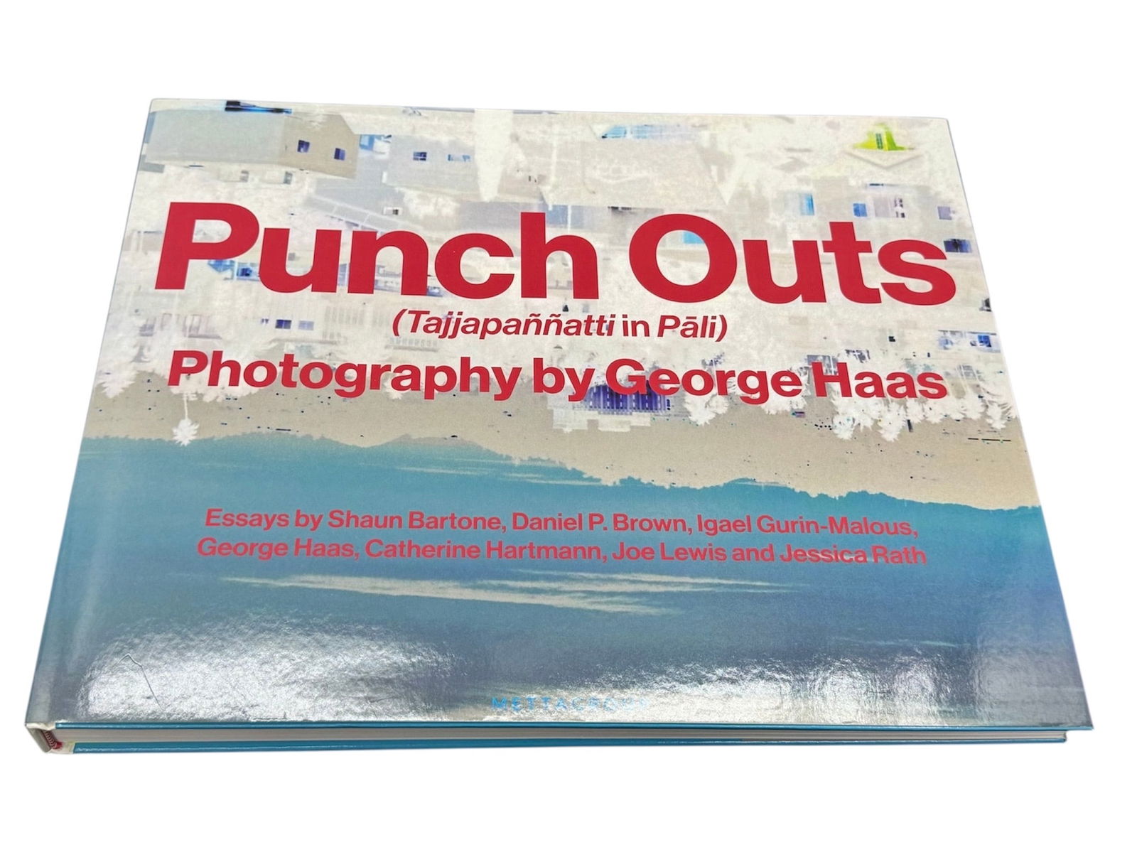 Punch Outs Tajjapannatti in Pali Photography by George Haas Oversized Coffee Table Book: Punch Outs (Tajjapannatti in Pali), a striking oversized photography book featuring work by George Haas. This large-format coffee table volume presents Haas’s bold photographic imagery with