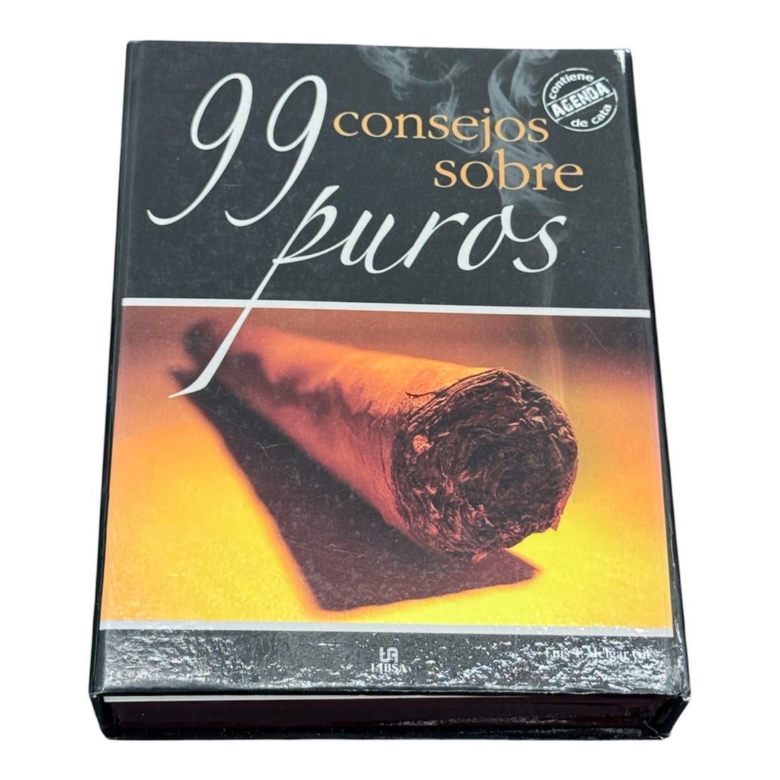 99 Consejos Sobre Puros Cigar Guide by Luis T. Melgari with Cata de Puros Booklet: A collectible boxed cigar guide titled 99 Consejos Sobre Puros by Luis T. Melgari. This presentation set includes the primary booklet along with a companion Cata de Puros tasting booklet housed