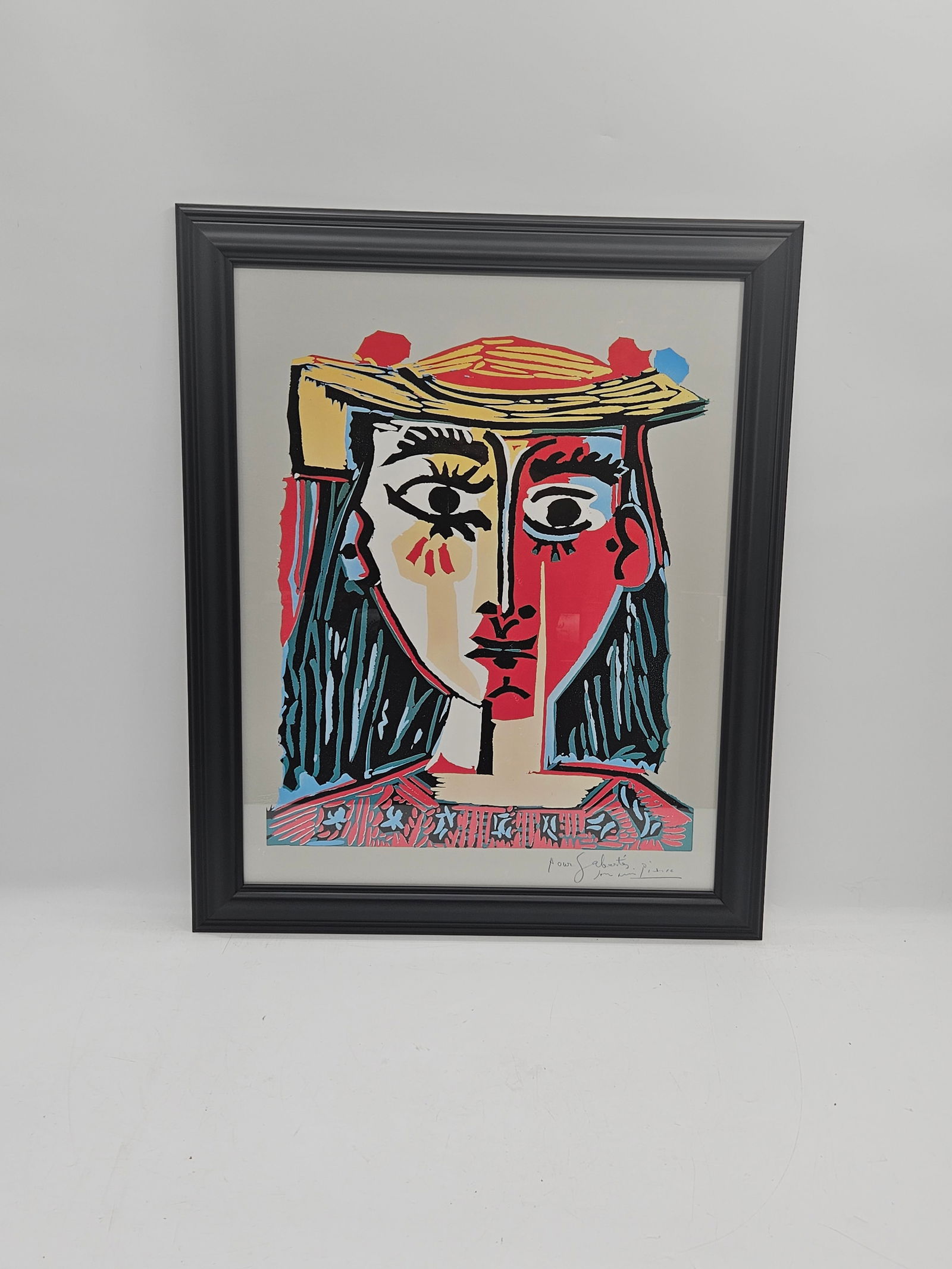 Portrait of Woman with Hat After Pablo Picasso Poster: Description: After Pablo Picasso, color print on paper, depicting a portrait of a woman with a hat. Framed.Dimensions: H:30in W:25in