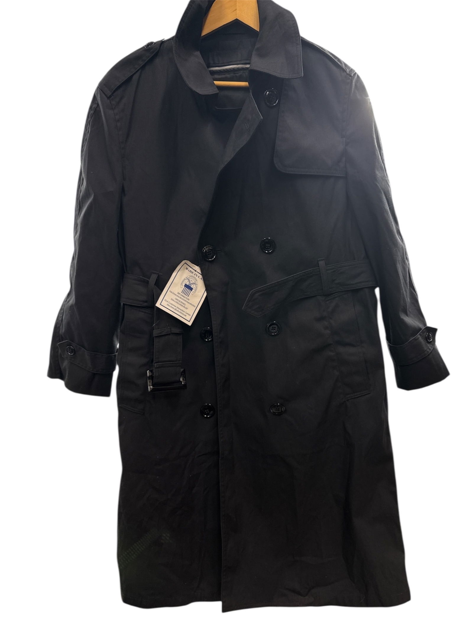 Garrison Collection Black Trench Coat Size 12S: Black trench-style coat from the Garrison Collection, featuring a double-breasted front, belted waist, and classic structured silhouette. The coat includes shoulder epaulets, cuff straps, and a storm
