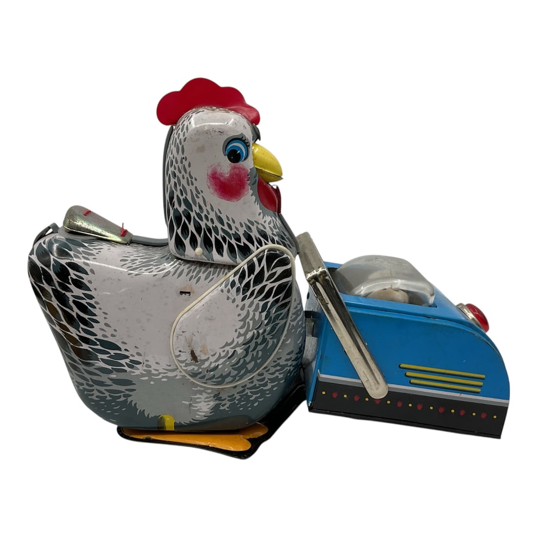 Vintage ME 603 Tin Lithograph Battery Operated Hen Toy Made in China: Charming vintage tin lithograph mechanical toy depicting a hen pushing a cart filled with chicks, likely model ME 603 made in China. Crafted from tin metal with colorful lithographed details, the toy