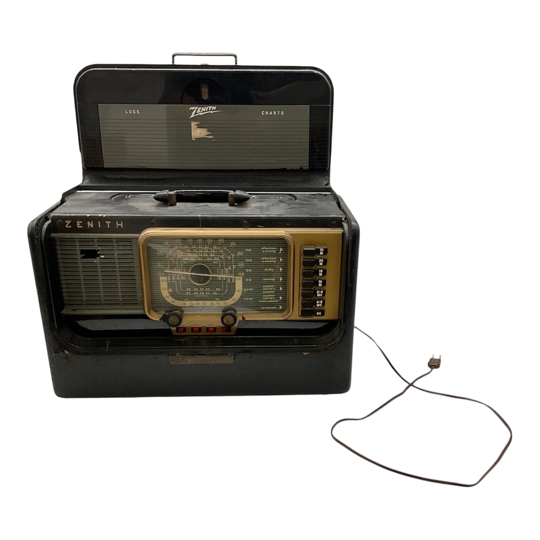 Zenith Trans Oceanic Wave Magnet Portable Radio: Vintage Zenith Trans Oceanic Wave Magnet portable radio featuring the iconic mid century design with front tuning dial and multi band display. Housed in a black case with integrated handle and hinged