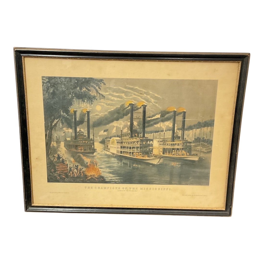 The Champion of the Mississippi Framed Currier and Ives Style Print: Framed print titled The Champion of the Mississippi A Race for the Buck Horns depicting multiple paddlewheel steamboats racing along the Mississippi River under a moonlit sky. The lively scene