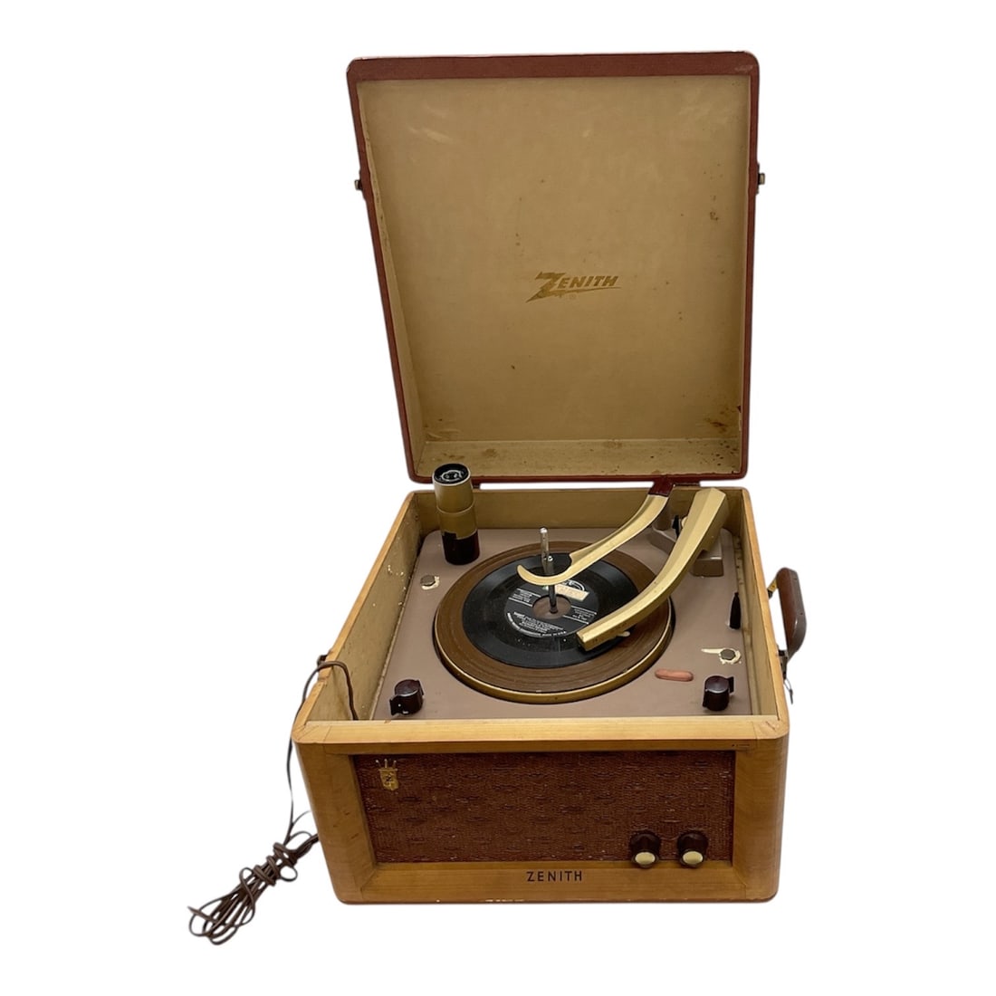 Zenith Portable Record Player in Case: Vintage Zenith portable record player housed in its original fitted case. The unit features a lift top lid with Zenith logo, built in turntable, tonearm, and front mounted control knobs. Designed for