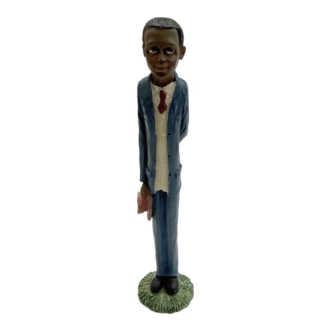 Hand Painted Figural Sculpture of Gentleman in Blue Suit: Charming hand painted figural sculpture depicting a gentleman standing in a blue suit with white shirt and red tie. The elongated stylized form features detailed facial expression and textured clothin