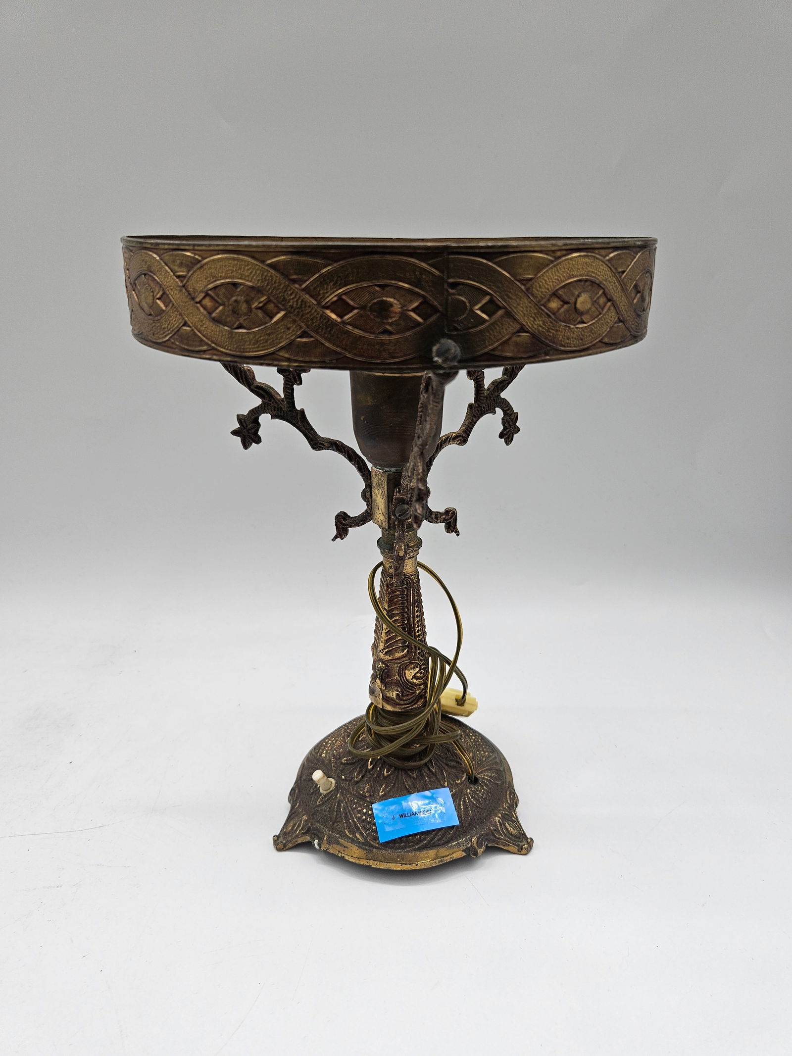 Converted Vintage Brass Lamp: Elegant vintage brass lamp repurposed from a decorative compote or centerpiece. Features ornate detailing and a warm aged patina, reflecting early 20th-century craftsmanship.