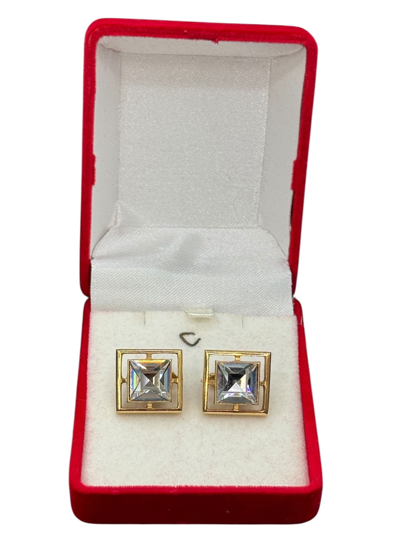 Avon Gold Tone Square Clip Earrings with Clear Stone Centers: A pair of vintage Avon clip-on earrings featuring square gold tone frames with clear faceted stone centers. The geometric design showcases a raised central stone set within an openwork square border,