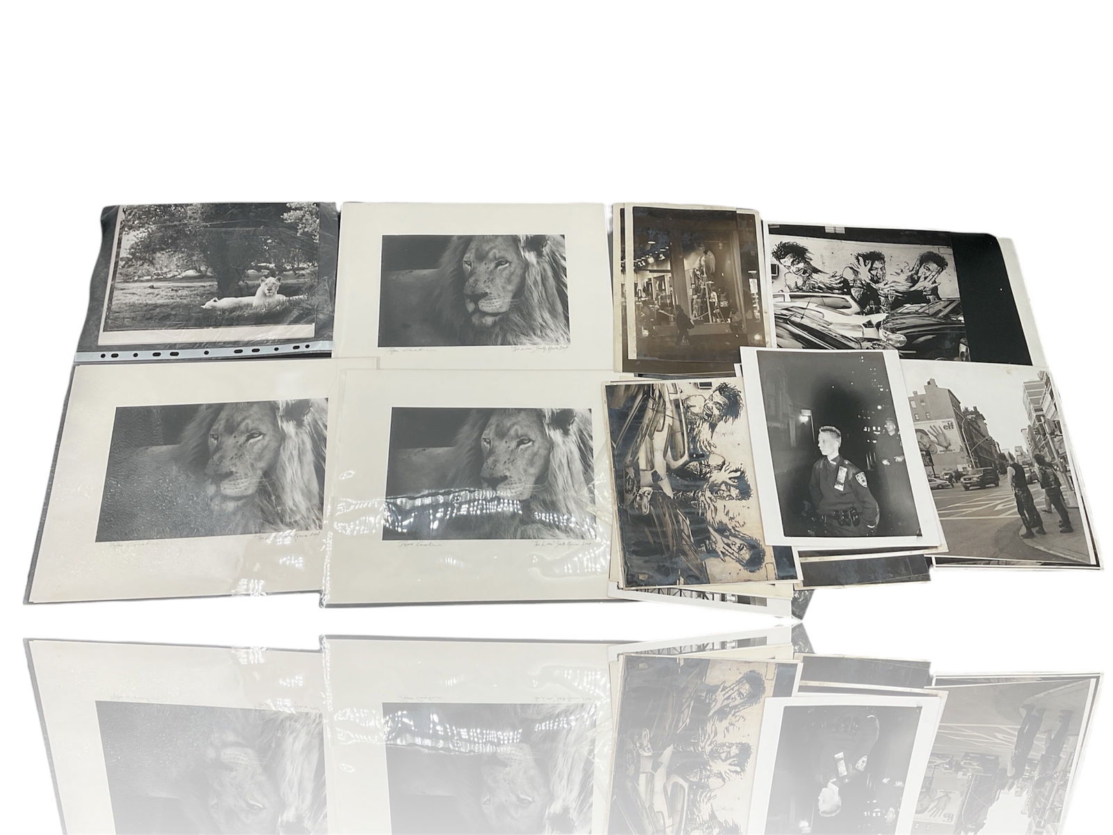 Lot of Vintage Black-and-White Photography.: Lot of vintage black-and-white photography.Subject Matter: Entertainment-related imagery, including movie stills, promotional portraits, and possibly architectural or urban scenes (as seen in