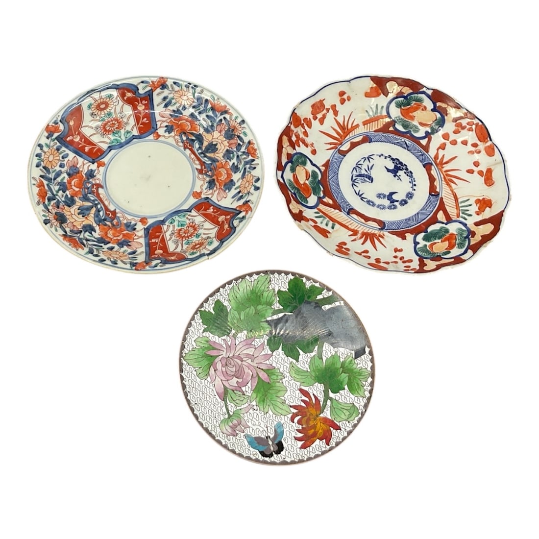 Collection of Porcelain Plates: This collection of decorative plates includes two examples of Japanese Imari porcelain, likely from the Meiji (1868–1912) or Taisho period, alongside a floral Chinese porcelain