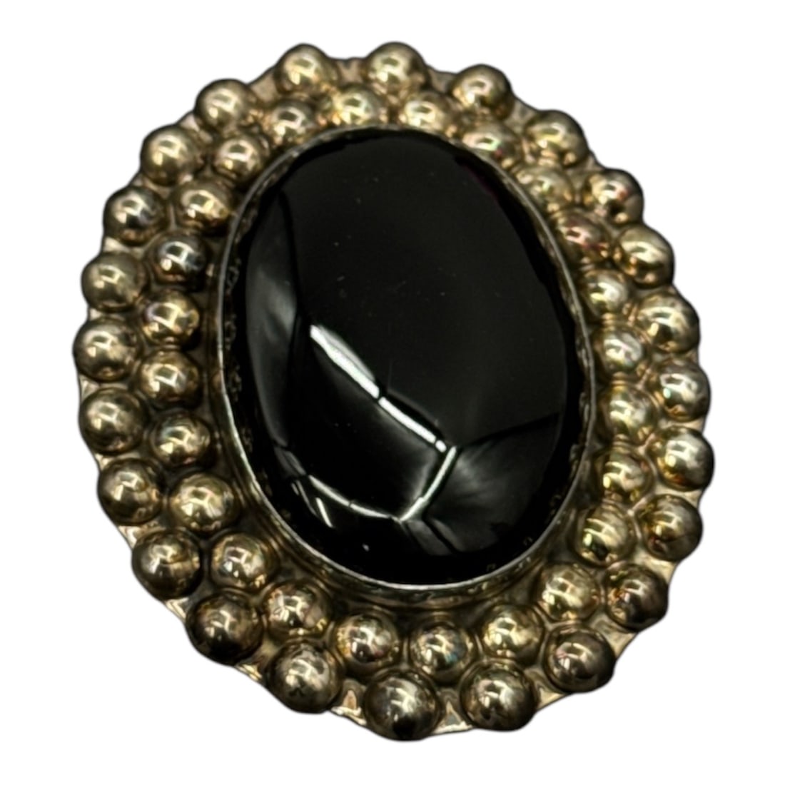 Vintage Mexican Sterling Silver Black Onyx Brooch (2in): Striking vintage brooch crafted in 925 sterling silver, Mexico, featuring a large polished black onyx cabochon set within a bold beaded silver surround. The dramatic contrast between the deep black
