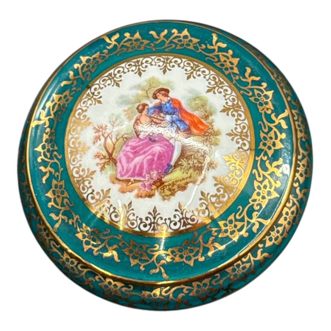Limoges France Miniature Porcelain Trinket Box with Romantic Scene: Charming miniature porcelain trinket box made in Limoges, France, featuring an elegant romantic courting scene at the center surrounded by rich teal enamel and ornate gilt scrollwork. The round