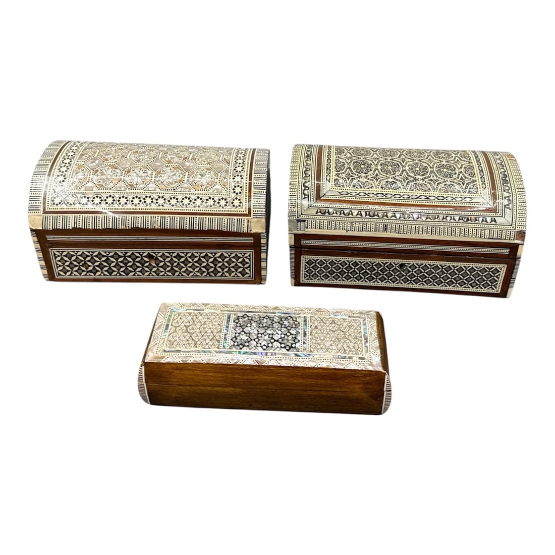 Middle Eastern Marquetry Mother of Pearl Jewelry Boxes: Middle Eastern marquetry jewelry boxes, likely of Egyptian or Syrian origin. They are handcrafted using a traditional technique involving the intricate inlay of exotic woods