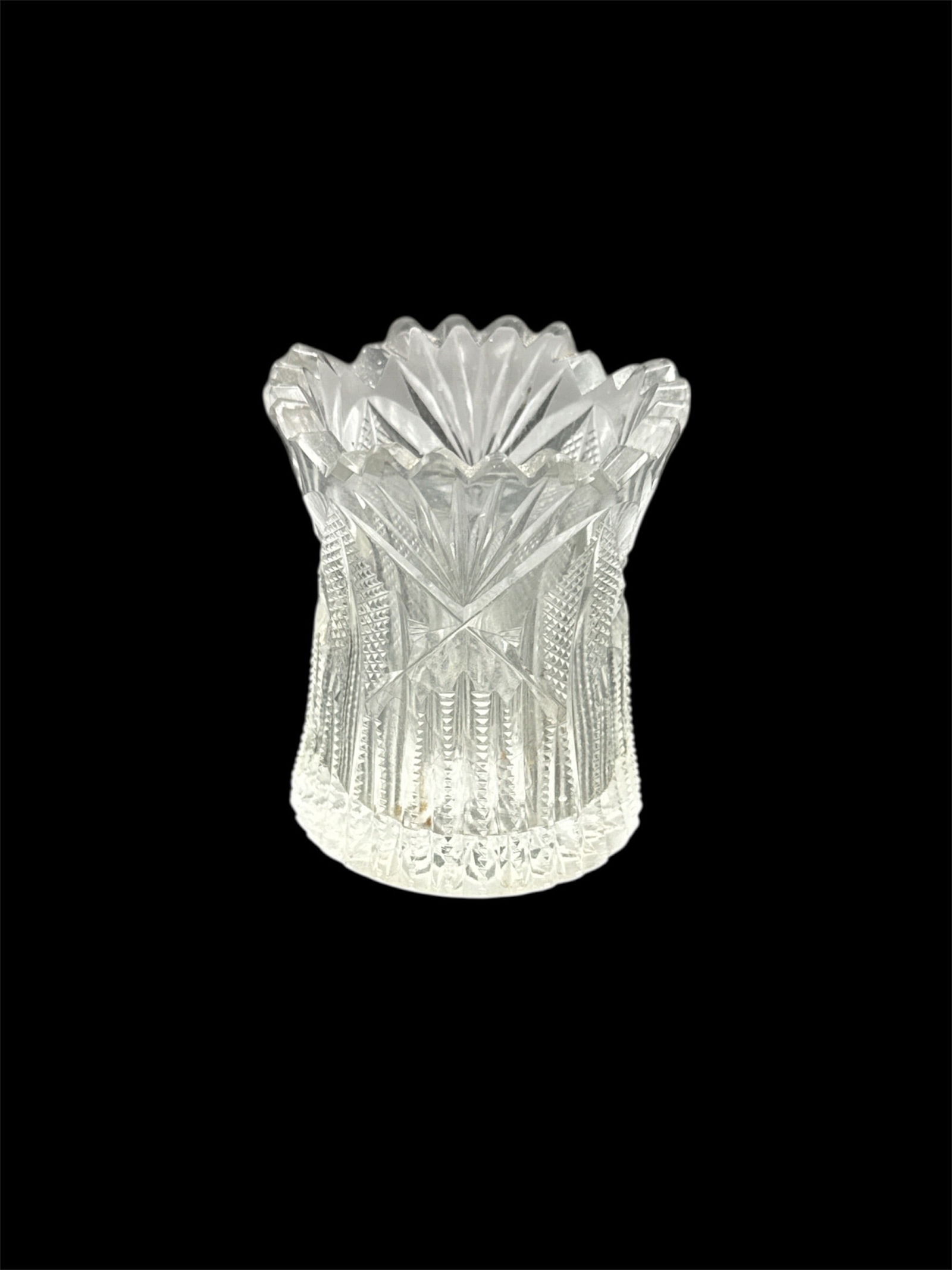 Cut Crystal Toothpick or Bud Vase: This lot features a small cut crystal vessel with faceted sides and a scalloped rim, suitable for use as a toothpick holder, small bud vase, or decorative crystal accent. The clear crystal
