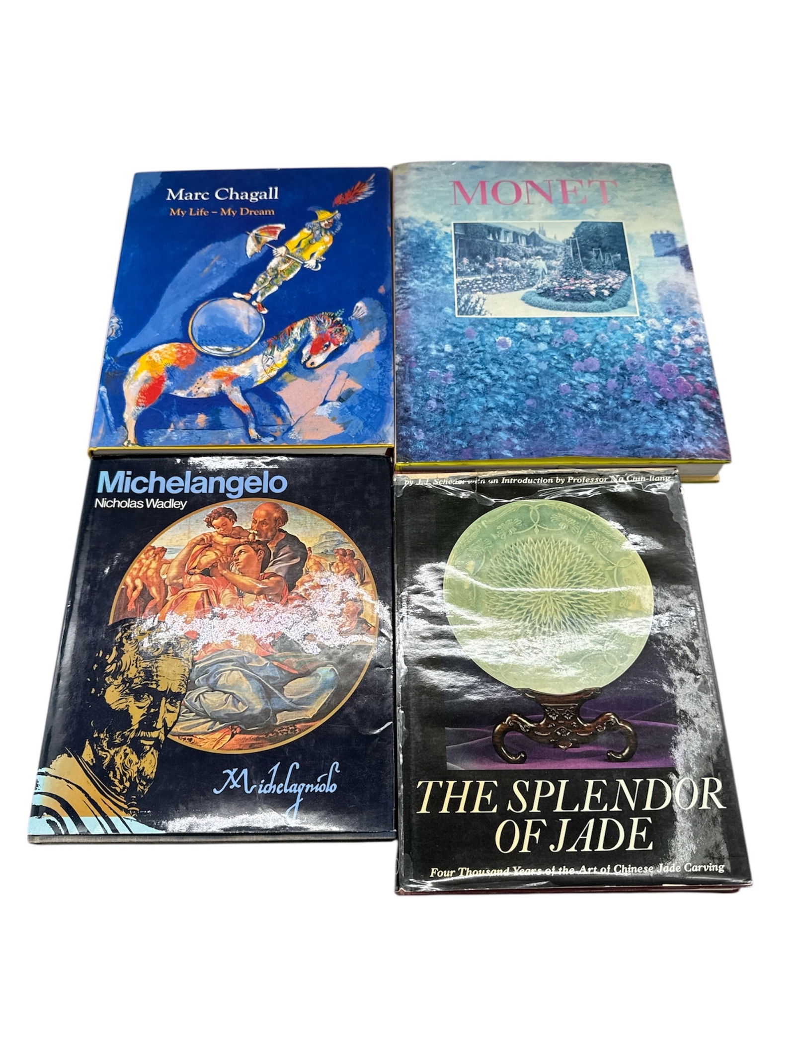 Collection of Art History Books Featuring Monet, Marc Chagall, Michelangelo, and Jade (1 of 2)