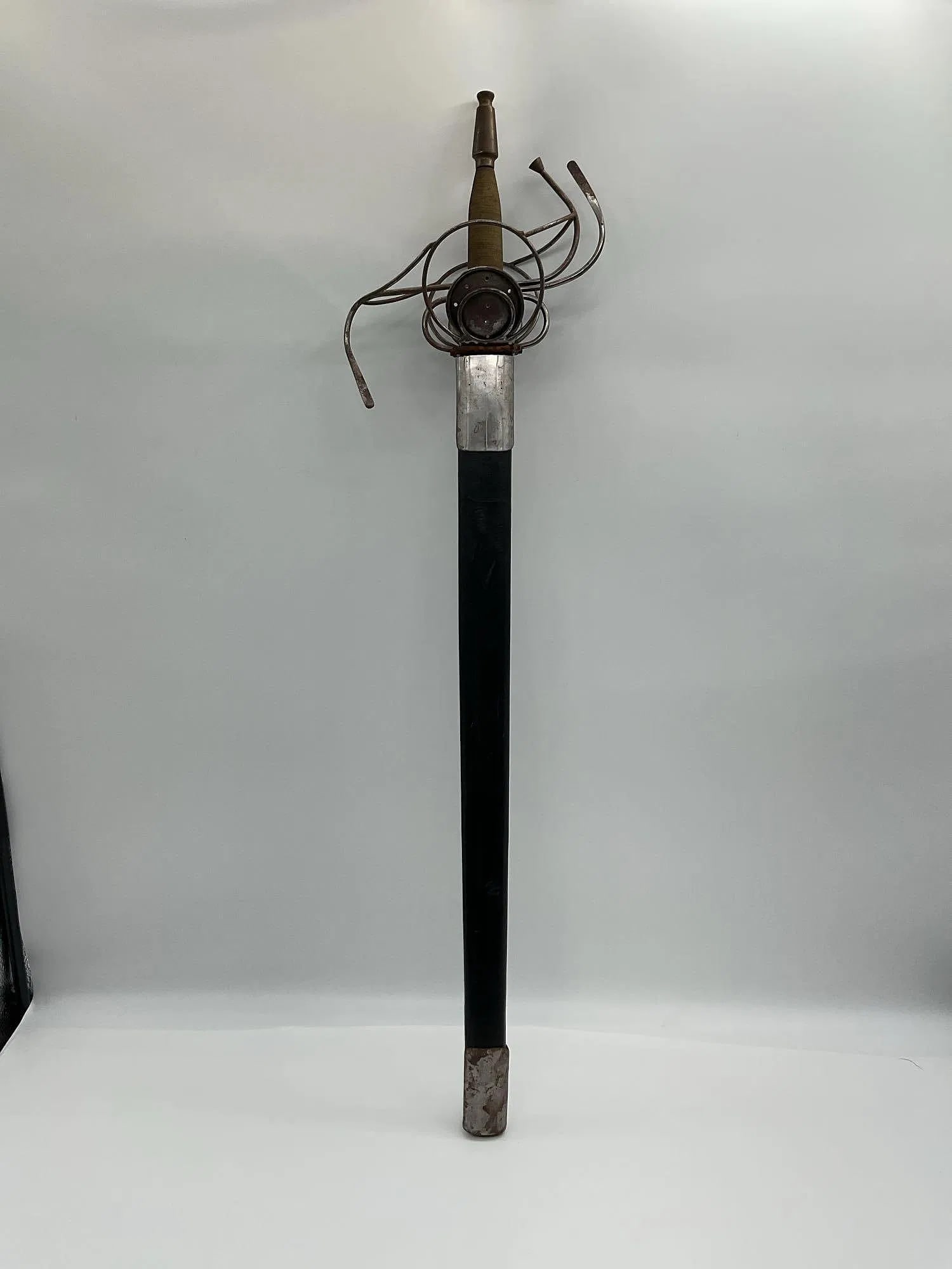 Replica 17th Century Rapier with Basket Hilt and Scabbard: Decorative reproduction of a 17th-century European rapier featuring a hand-forged-style blade and elaborate steel wire-wrapped basket hilt. The guard is designed for hand protection during dueling or