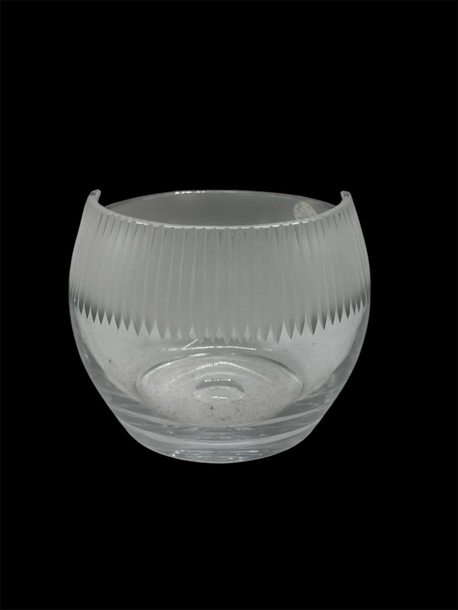 Modern Clear Glass Bowl with Vertical Ribbed Detail: Contemporary clear glass bowl featuring a rounded form with vertical ribbed detailing along the upper body. The smooth lower section transitions into a circular base, creating a clean and balanced