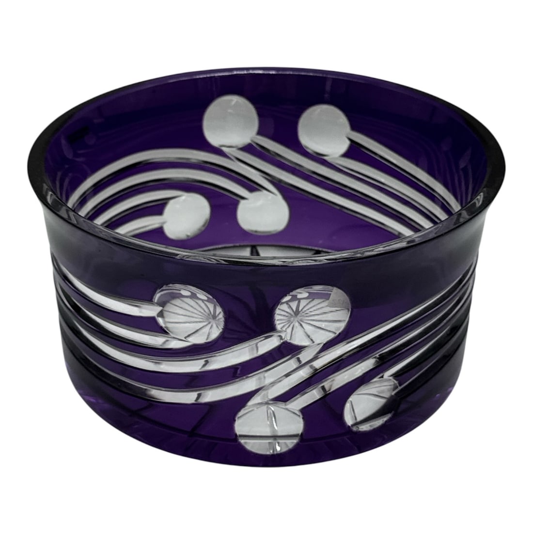Purple Art Glass Bowl with Etched Floral Motif: Striking purple art glass bowl featuring a rich amethyst tone and bold etched floral and vine motif wrapping around the body. The design includes flowing linear bands accented by stylized blossoms,
