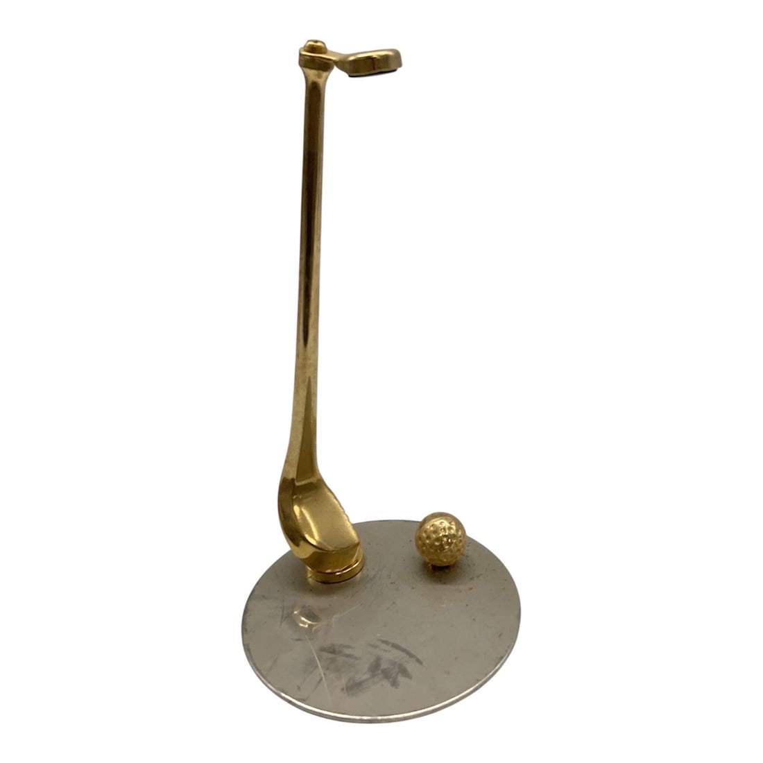 Brass Golf Club and Ball Desk Sculpture: Decorative brass desk sculpture featuring a stylized golf club positioned beside a textured golf ball, mounted on a circular metal base. The elongated club design gives the piece a modernist look whil