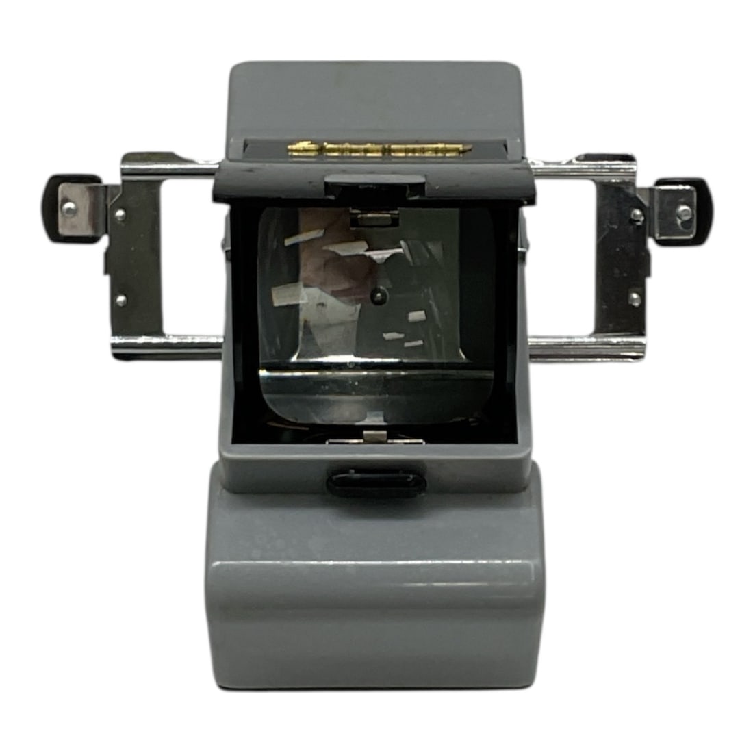 Daybrite Table Brockway Viewer with Original Box: Vintage Daybrite Table Brockway Viewer designed for viewing photographic slides or transparencies. The compact tabletop viewer features a metal body with viewing lens and slide holder arms extending f