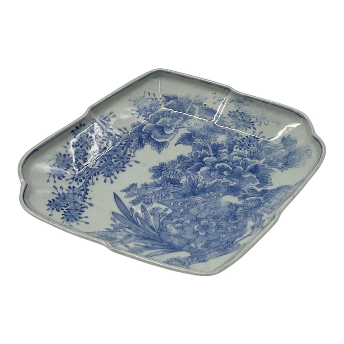 Chinese Blue and White Porcelain Scenic Serving Dish: Chinese blue and white porcelain serving dish featuring a scenic landscape decoration with trees, foliage, and architectural elements rendered in cobalt blue. The dish has an irregular shaped rim with