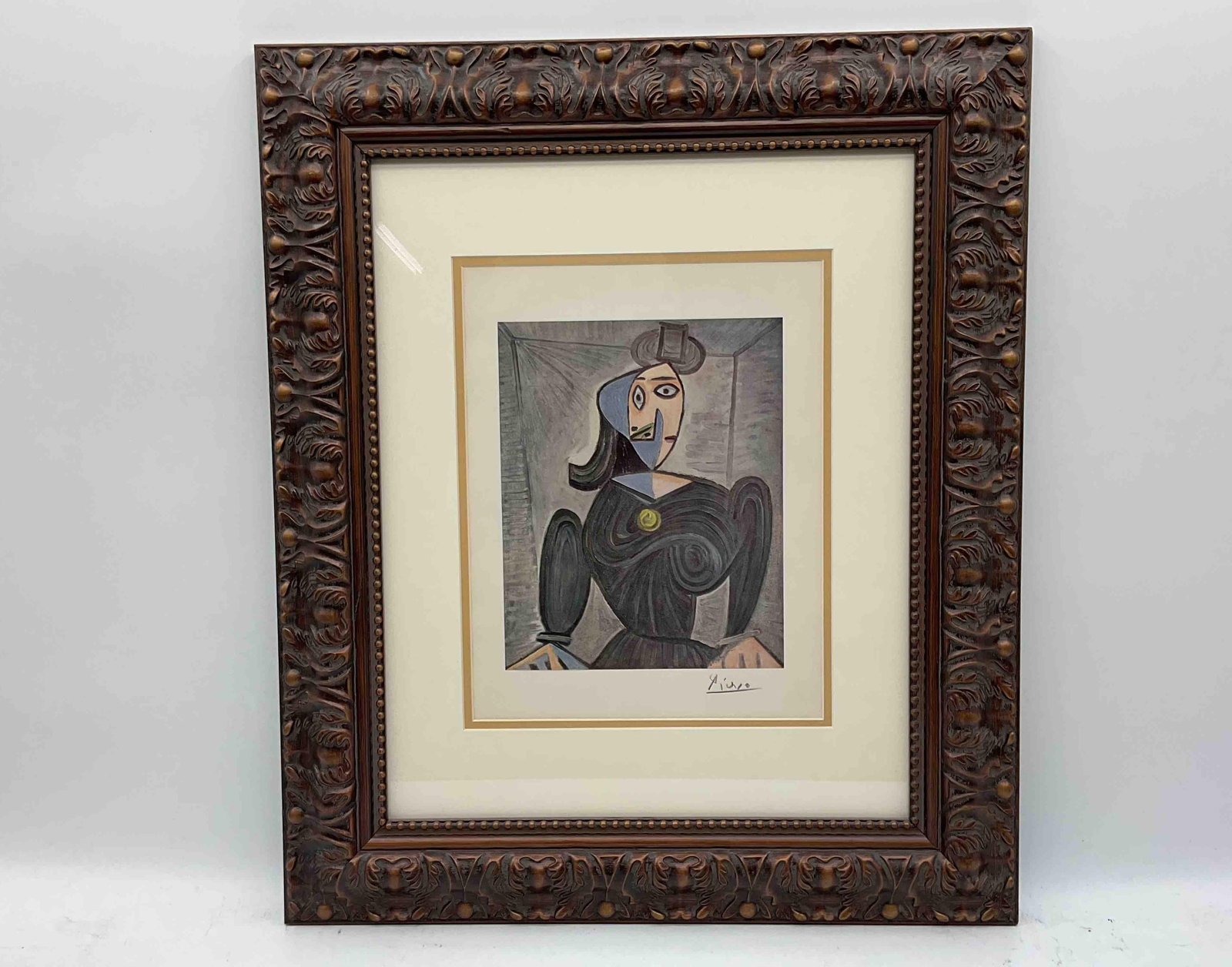 "Portrait of Maar" by Pablo Picasso Lithograph: Framed print of Pablo Picasso's cubist-style portrait depicting a seated woman with folded arms, rendered in muted tones with blue and black accents. Matted and set in an ornate carved wooden fram