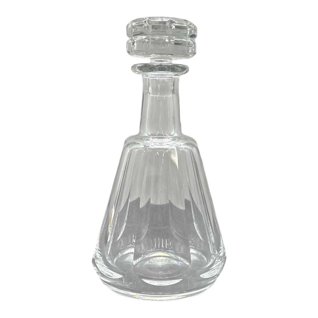 Baccarat Crystal Decanter with Stopper: Elegant Baccarat crystal decanter featuring a tapered faceted body and original geometric stopper. Marked Baccarat on the underside. A refined barware piece showcasing t