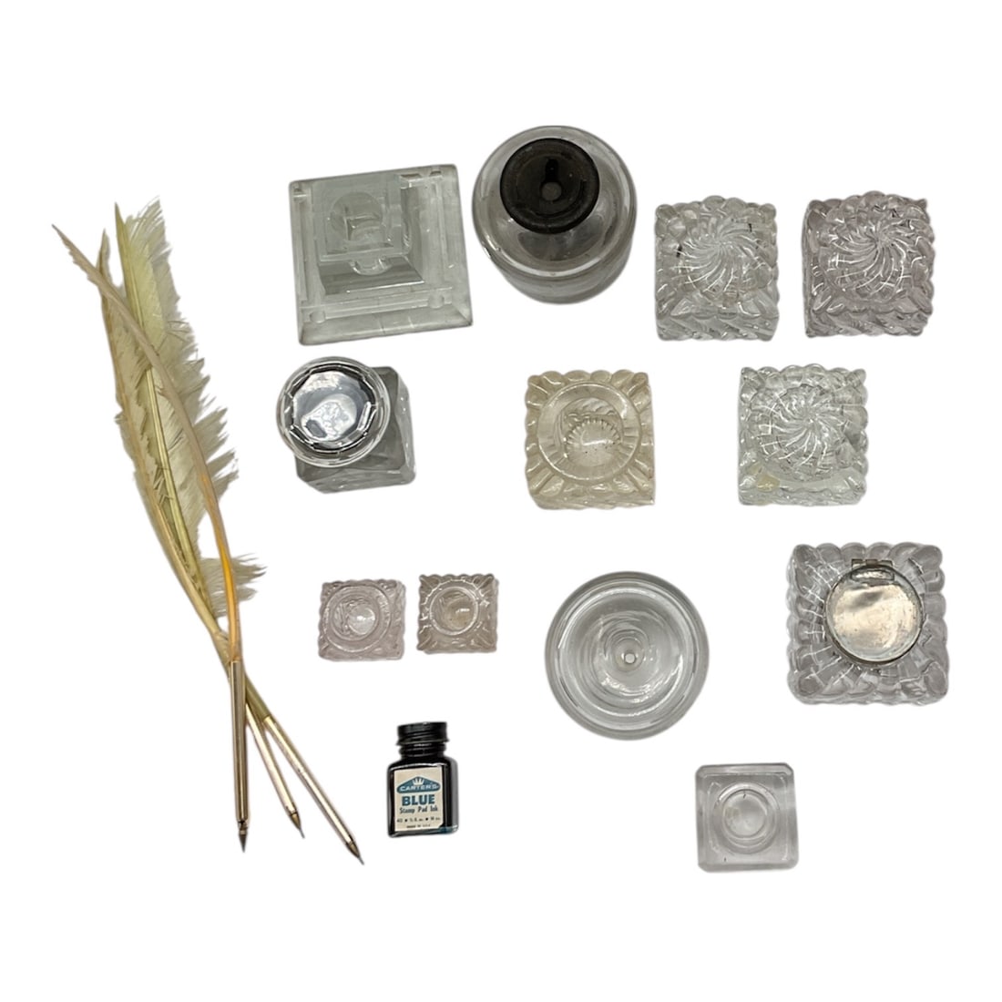 Collection of Antique and Vintage Glass Inkwells with Quill Pens and Ink, 19th–20th Century: This vintage writing set features a comprehensive collection of antique desk accessories, including a variety of clear glass and crystal inkwells, quill pens, and an original ink bottle.