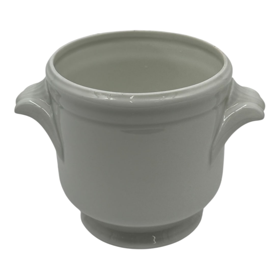 Limoges France Porcelain Cachepot Planter: A white porcelain cachepot planter produced in Limoges, France. The piece features a classic cylindrical form with two molded side handles and a slightly flared rim, raised on a small circular foot. T