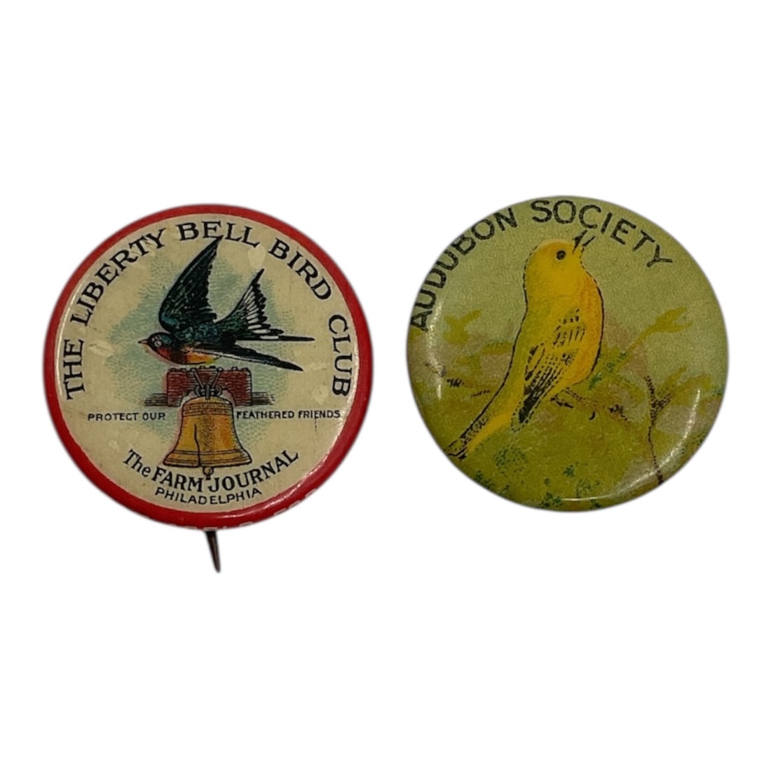 Audubon Society and Liberty Bell Bird Club Pinback Button Collection Bastian Brothers: Collection of two vintage bird-themed pinback buttons, including an Audubon Society example depicting a yellow warbler and a Liberty Bell Bird Club pin featuring a barn swallow with Farm Journal Phila