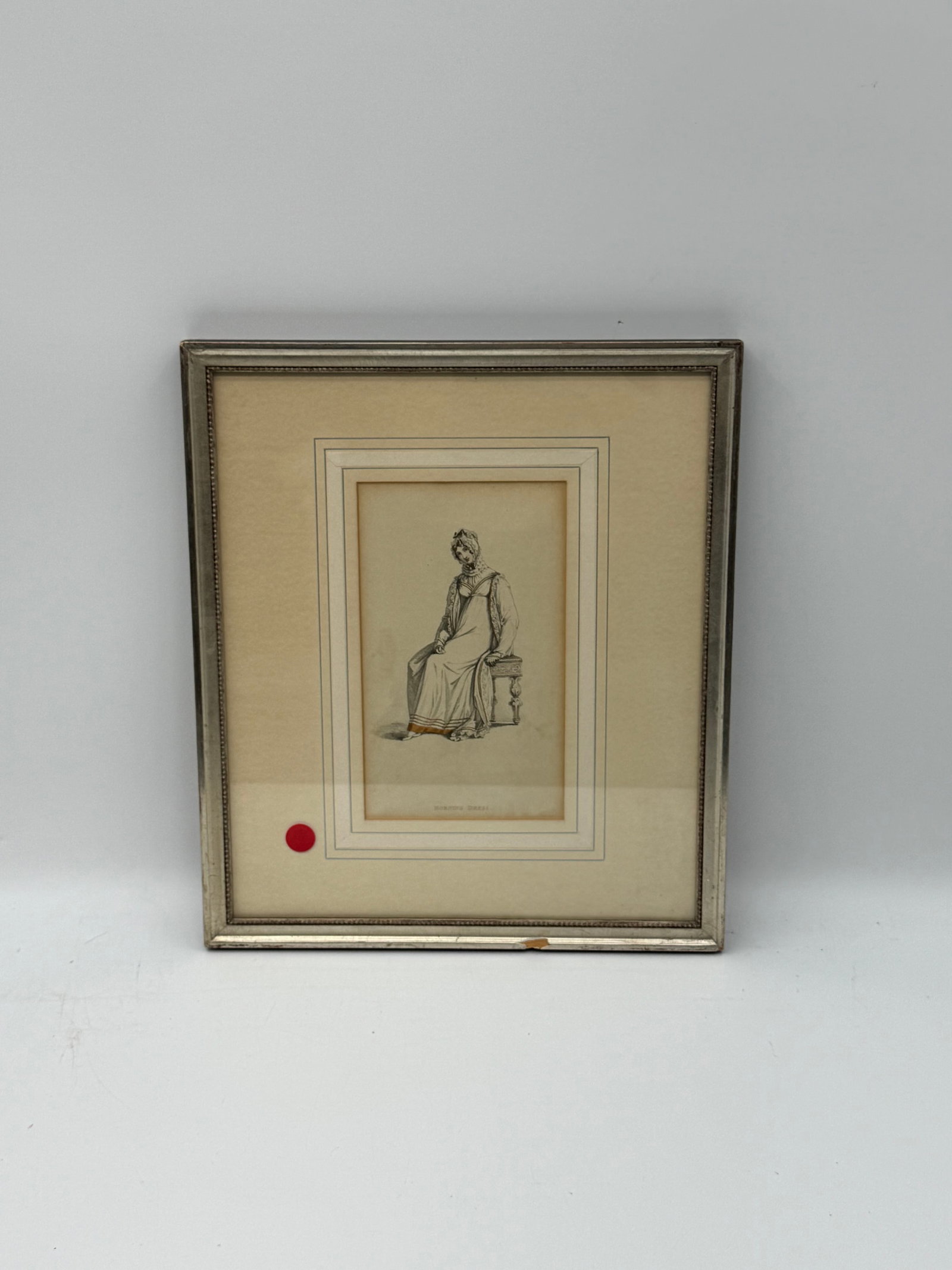 Antique Engraving “Morning Dress: Antique engraving titled Hebrew Dress, depicting a seated figure in traditional attire with fine line detail and subtle hand coloring. Presented in a matted frame with light age toning consistent