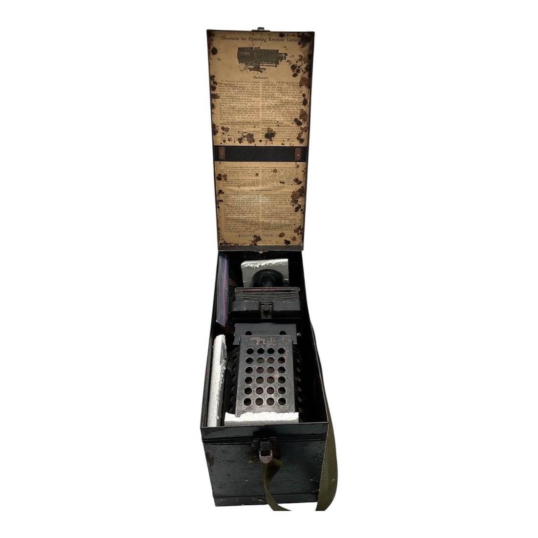 Vintage Portable Photographic Enlarger in Metal Carrying Case: Vintage portable photographic enlarger housed in a metal carrying case, designed for compact darkroom use and field transport. The unit features a bellows enlarger assembly with lens mount and