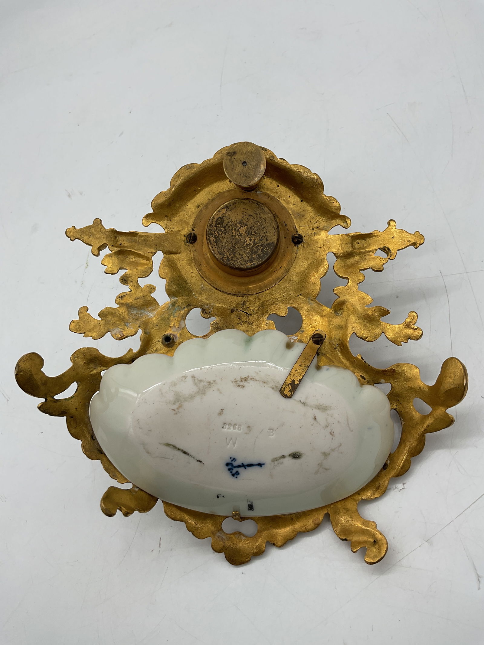 Antique Meissen Porcelain and Gilt Bronze Inkwell: Exquisite antique inkwell combining Meissen porcelain and ornate gilt bronze mounts. The porcelain base features delicate floral relief detailing, while the bronze structure displays intricate rococo