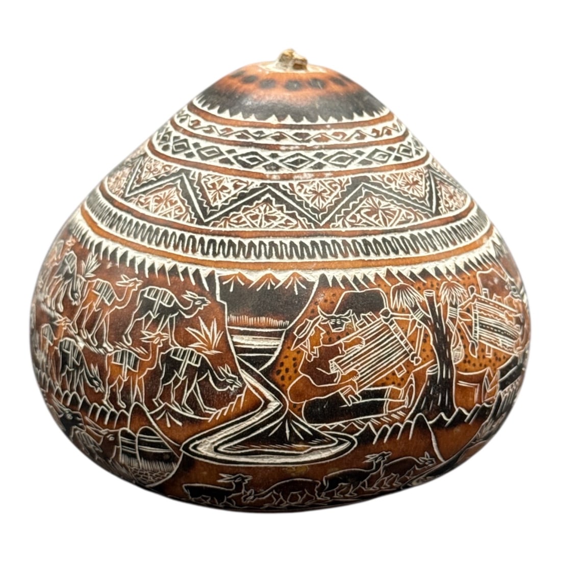 Decorative Hand-Etched Pottery Vessel with Figural Motifs: Decorative pottery vessel featuring a rounded form adorned with hand-etched figural and geometric motifs throughout. The surface is richly decorated with scenes of animals, figures, and abstract patte