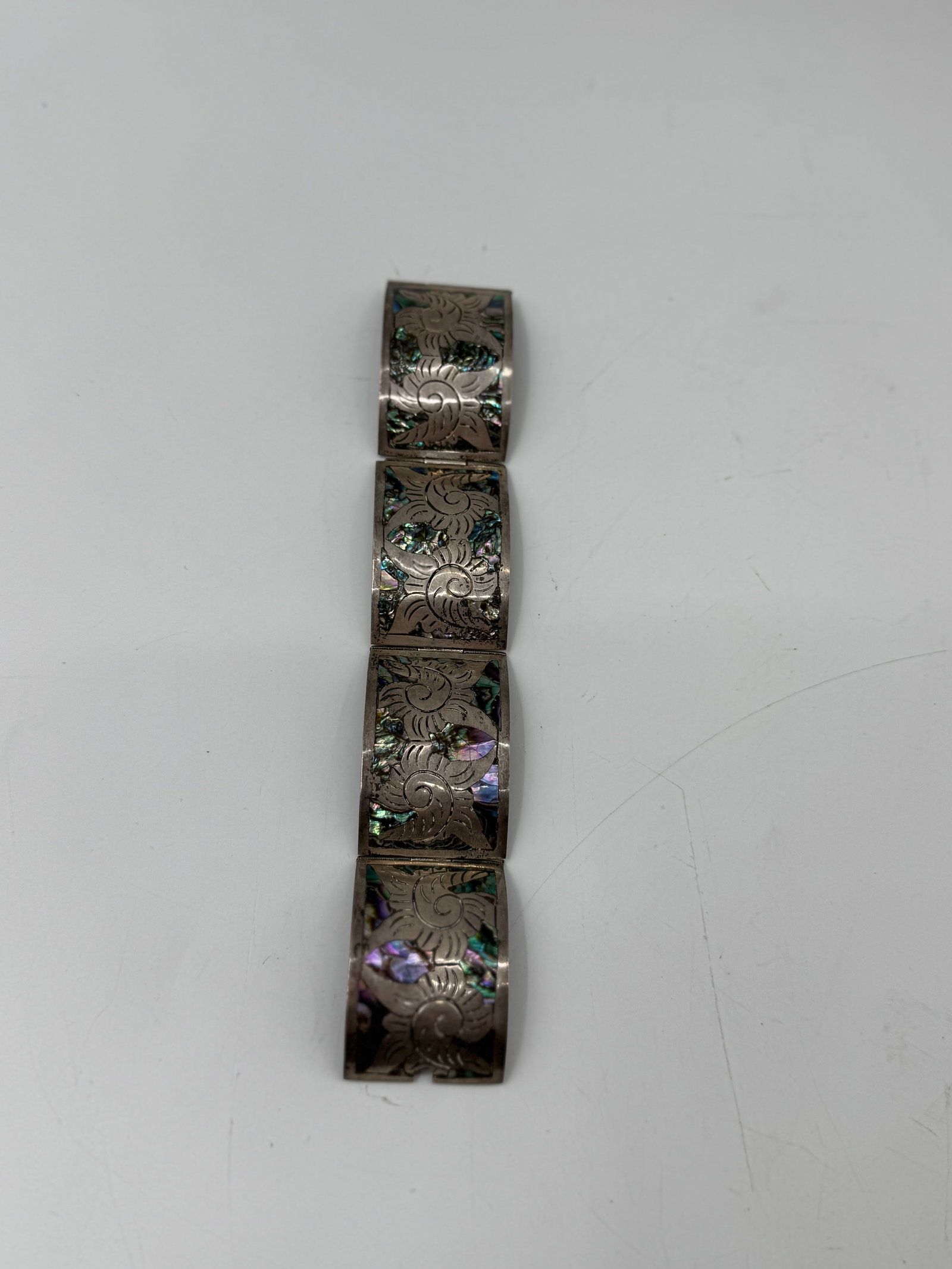Vintage Taxco Sterling Silver Bracelet with Abalone Inlay: Marked "JHP Hecho en Mexico 925", wrap around style with four abalone panels. Weight: 39 g 7 inches long