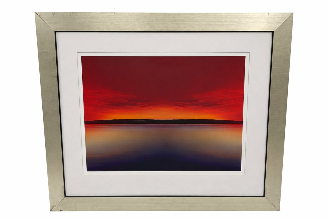 “Red Sunset?? by Thomas Brun (Contemporary) Limited Edition Print: Dramatic seascape photograph by contemporary artist Thomas Brun titled Red Sunset. The composition captures a striking horizon line beneath a vivid crimson sky as the fading sun casts intense red and