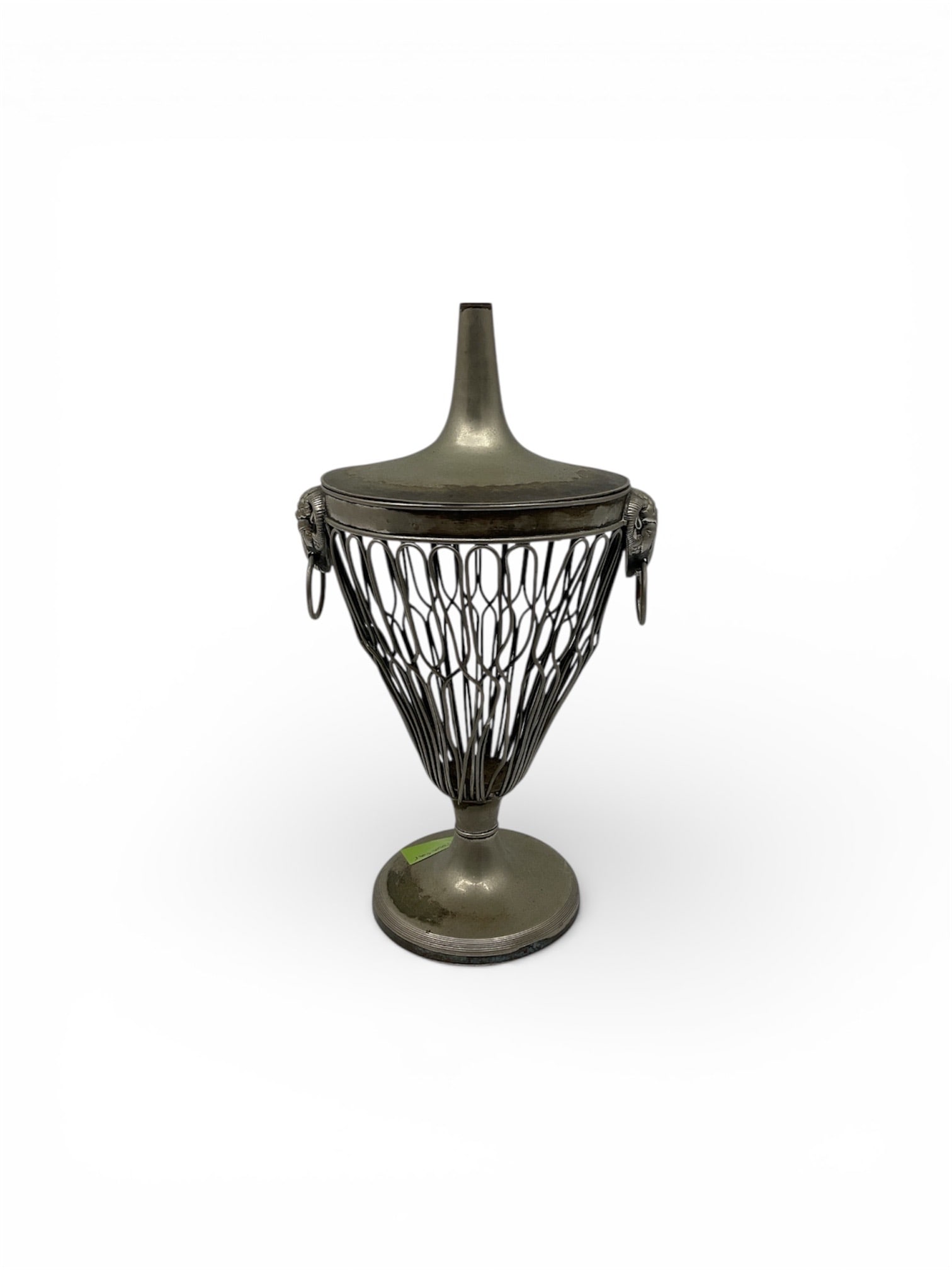Regency Style Silver-Tone Wirework Urn with Ram's Head Masks: This elegant decorative urn is a sophisticated example of Regency Style wirework, designed to mimic the neoclassical metalwork of the early 19th century. The vessel features an open-work conical body