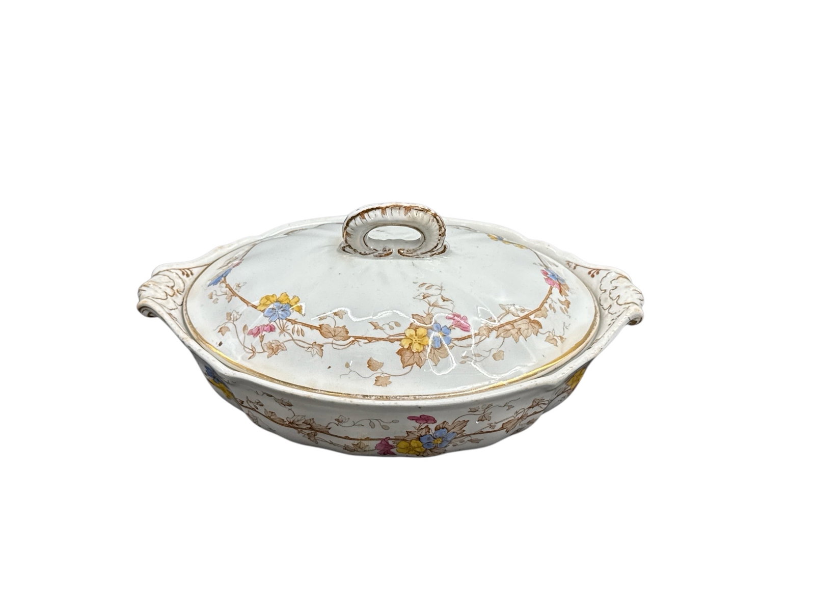 Antique French Limoges Covered Porcelain Serving Dish with Hand-Painted Decoration: This elegant antique French Limoges covered serving dish features classic hand-painted decoration with delicate figural and floral motifs accented by soft pastel tones and gilt highlights. The piece i